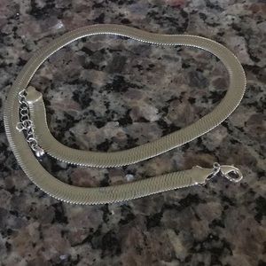 Silver necklace 1/4” wide.